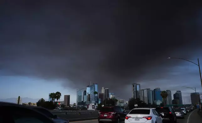 The sky is filled with smoke from a warehouse fire in Los Angeles on Wednesday, June 17, 2026. (AP Photo/Jae C. Hong)