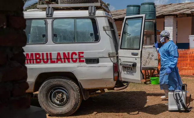 A health worker disinfects an ambulance at the Mongbwalu treatment center that transported a suspected Ebola patient in Mongbwalu, Congo, Friday, June 5, 2026. (AP Photo/Moses Sawasawa)
