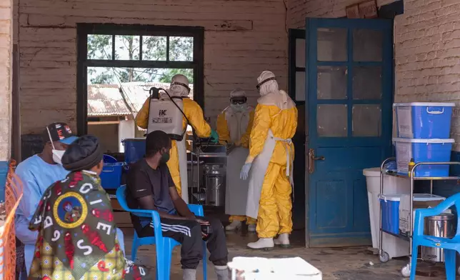 Health workers prepare for duty at the Mongbwalu treatment center in Mongbwalu, Congo, Friday, June 5, 2026. (AP Photo/Moses Sawasawa)