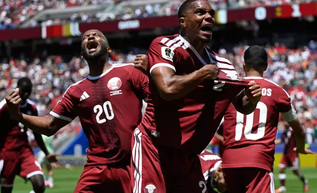 Qatar's Pedro Miguel, yells as he celebrates after teammate Qatar's Boualem Khoukhi, scored his sides first goal during the World Cup Group B soccer match between Qatar and Switzerland in Santa Clara, Calif., near San Francisco, Saturday, June 13, 2026. (AP Photo/Eakin Howard)