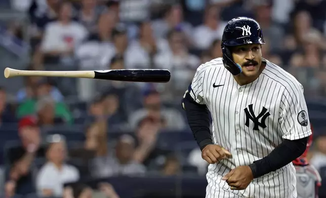 New York Yankees' Trent Grisham reacts after hitting a solo home run during the fifth inning of a baseball game against the Boston Red Sox, Friday, June 5, 2026, in New York. (AP Photo/Adam Hunger)
