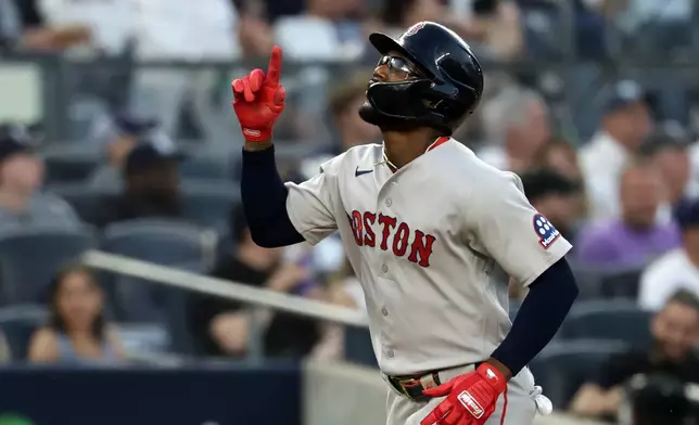 Boston Red Sox's Andruw Monasterio reacts after hitting a solo home run during the fourth inning of a baseball game against the New York Yankees, Friday, June 5, 2026, in New York. (AP Photo/Adam Hunger)