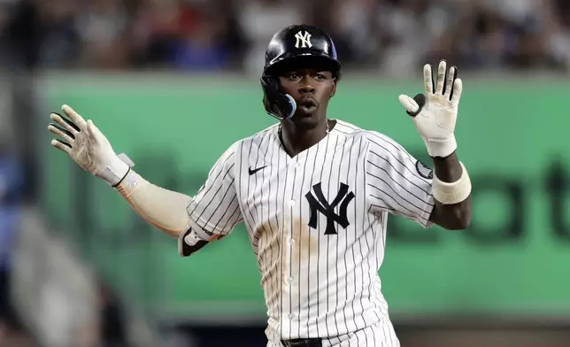 New York Yankees' Jazz Chisholm Jr. reacts after hitting a foul ball during the sixth inning of a baseball game against the Boston Red Sox, Friday, June 5, 2026, in New York. (AP Photo/Adam Hunger)