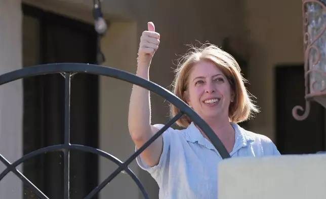 Marni von Wilpert, a Democratic candidate for California's 48th Congressional District, canvasses in a neighborhood Friday, May 29, 2026, in San Marcos, Calif. (AP Photo/Gregory Bull)