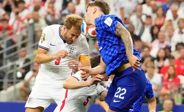 England's Harry Kane (9) heads the ball and scores a goal during the World Cup Group L soccer match between England and Croatia in Arlington, Texas, near Dallas, Wednesday, June 17, 2026. (AP Photo/Tony Gutierrez)