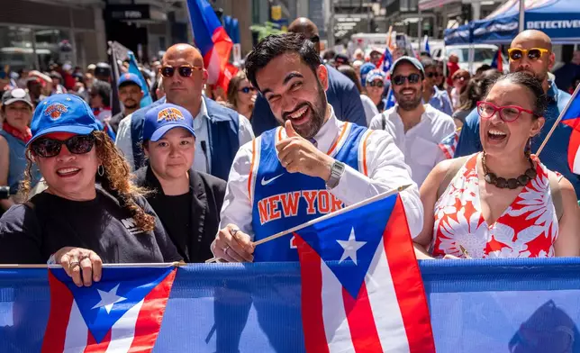 New York City Mayor Zohran Mamdani takes part in the National Puerto Rican Day Parade, Sunday, June 14, 2026 in New York. (AP Photo/Adam Gray)