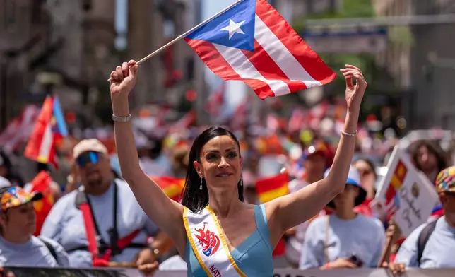 Dayanara Torres takes part in the National Puerto Rican Day Parade, Sunday, June 14, 2026 in New York. (AP Photo/Adam Gray)