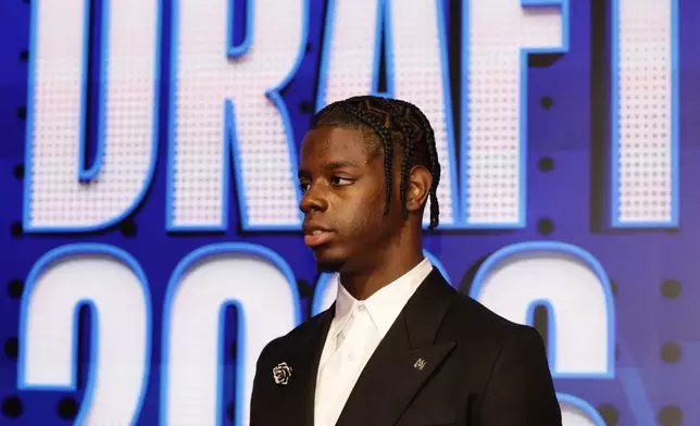 Caleb Wilson arrives for the first round of the NBA basketball draft Tuesday, June 23, 2026, in New York. (AP Photo/Adam Hunger)