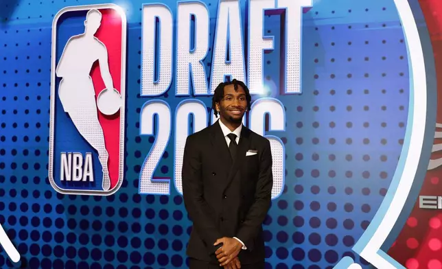 Darryn Peterson arrives for the first round of the NBA basketball draft Tuesday, June 23, 2026, in New York. (AP Photo/Adam Hunger)