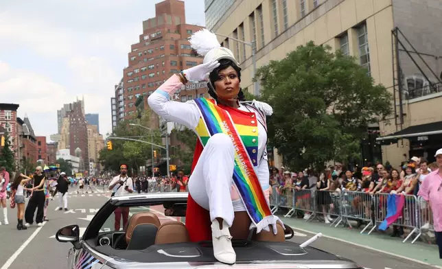 Peppermint, one of the official Grand Marshals for the 2026 NYC Pride March, salutes to parade-goers, Sunday, June 28, 2026 in New York. (AP Photo/Pamela Smith)