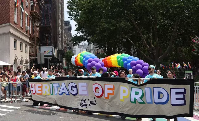 Parade-goers attend the NYC Pride March near the Stonewall Inn, Sunday, June 28, 2026 in New York. (AP Photo/Pamela Smith)