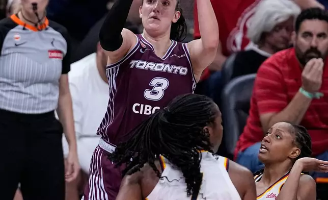 Toronto Tempo guard Marina Mabrey (3) shoots over Indiana Fever center Aliyah Boston (7) in the second half of a WNBA Commissioner's Cup basketball game in Indianapolis, Tuesday, June 16, 2026. (AP Photo/Michael Conroy)
