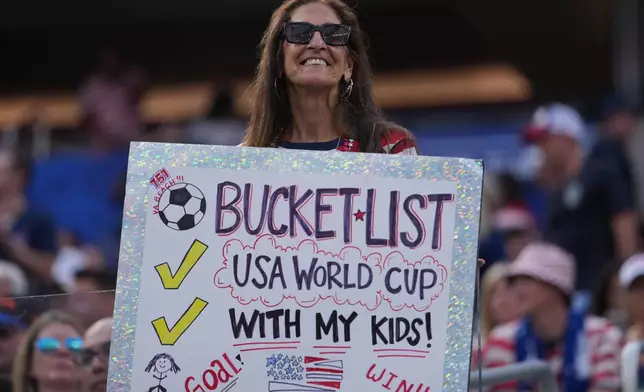 A fan waits for the beginning of the World Cup Group D soccer match between the United States and Paraguay in Inglewood, Calif., near Los Angeles, Friday, June 12, 2026. (AP Photo/Jae C. Hong)
