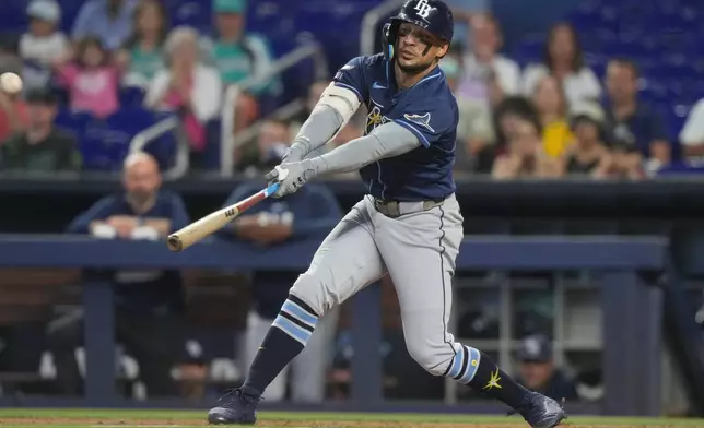Tampa Bay Rays Victor Mesa Jr. hits a single to right field during the second inning of a baseball game against the Miami Marlins Sunday, June 7, 2026, in Miami. (AP Photo/Marta Lavandier)