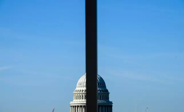 The U.S. Capitol is seen behind a light pole, on Capitol Hill in Washington, Wednesday, June 3, 2026. (AP Photo/Cliff Owen)