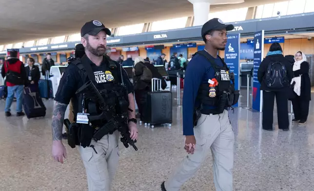 FILE - Department of Homeland Security, Transportation Security Administration, Federal Air Marshals, patrol around Washington Dulles International Airport, in Chantilly, Va., Tuesday, March 24, 2026. (AP Photo/Manuel Balce,File)