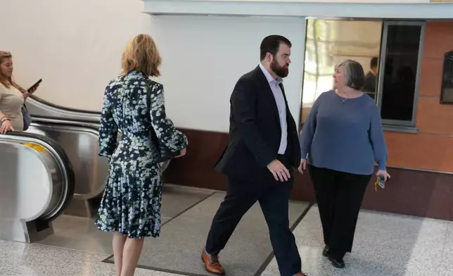 Colin Hortman, center, son of Melissa and Mark Hortman, walks inside the federal courthouse in Minneapolis on Thursday, June 11, 2026. (Alex Kormann/Minnesota Star Tribune via AP)