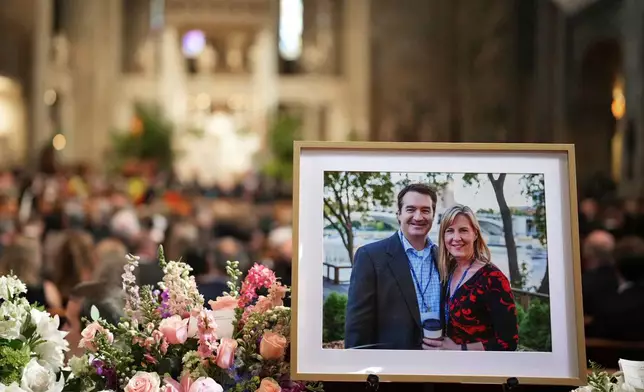 FILE - A photo of Mark and Melissa Hortman is displayed during their funeral service inside the sanctuary at the Basilica of St. Mary's in Minneapolis on June 28, 2025. (Alex Kormann/Star Tribune via AP, Pool, File)