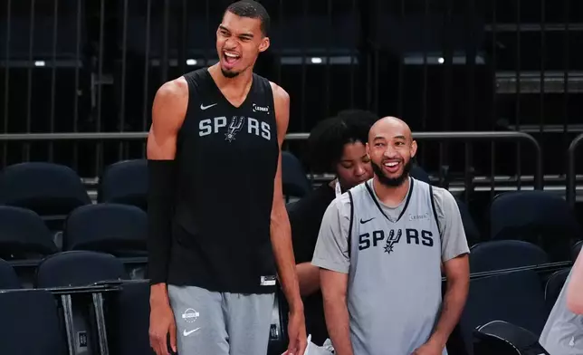 San Antonio Spurs forward Victor Wembanyama laughs during practice prior to Game 3 of the NBA Finals basketball series against the New York Knicks, Sunday, June 7, 2026, in New York. (AP Photo/Ross D. Franklin)