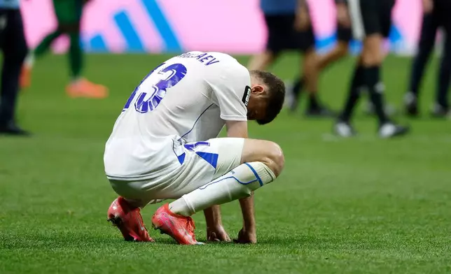 Uzbekistan's Sherzod Nasrullaev (13) reacts to a loss during the World Cup Group K soccer match between DR Congo and Uzbekistan in Atlanta, Saturday, June 27, 2026. (AP Photo/Erik S. Lesser)
