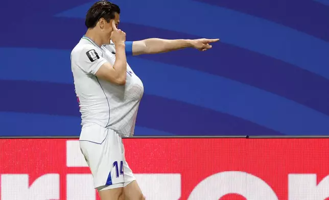 Uzbekistan's Eldor Shomurodov (14) celebrates after scoring their first goal during the World Cup Group K soccer match between DR Congo and Uzbekistan in Atlanta, Saturday, June 27, 2026. (AP Photo/Erik S.Lesser)