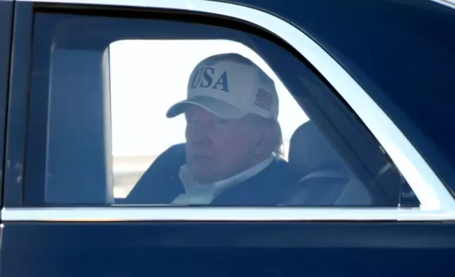 President Donald Trump sits in his limousine, known as The Beast, after arriving on Marine One at Joint Base Andrews, Md., Sunday, June 21, 2026, following a trip to Camp David. (AP Photo/Mark Schiefelbein)