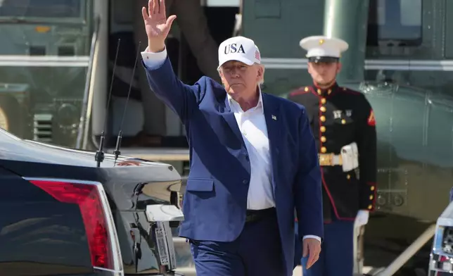 President Donald Trump waves as he arrives on Marine One at Joint Base Andrews, Md., Sunday, June 21, 2026, following a trip to Camp David. (AP Photo/Mark Schiefelbein)