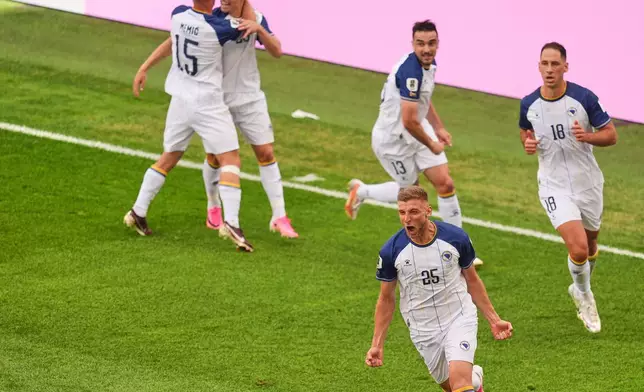 Bosnia's Jovo Lukic (25) celebrates after scoring the opening goal during the World Cup Group B soccer match between Canada and Bosnia in Toronto, Friday, June 12, 2026. (AP Photo/Jared Freed)
