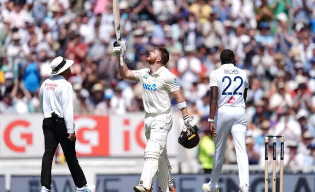 New Zealand's Glenn Phillips celebrates his century on day two of the second cricket test between England and New Zealand, in London, Thursday, June 18, 2026. (Ben Whitley/PA via AP)