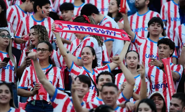 Paraguay's fans cheer prior to an international friendly soccer match against Nicaragua in Asuncion, Paraguay, Friday, June 5, 2026. (AP Photo/Jorge Saenz)