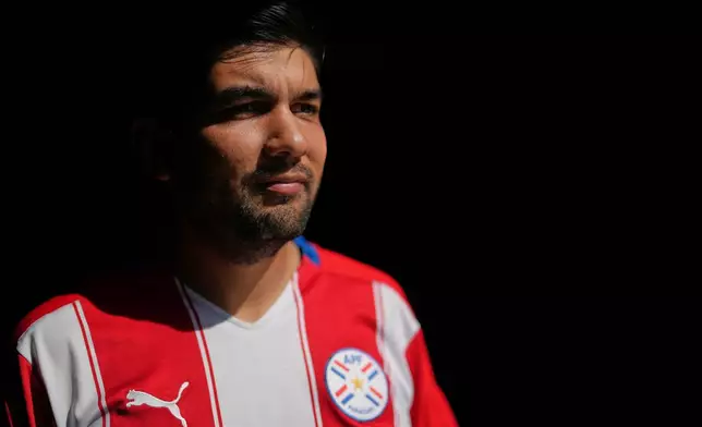 Rodrigo Valdez wears a team Paraguay soccer jersey as he poses for a picture Friday, June 5, 2026, in San Diego. (AP Photo/Gregory Bull)