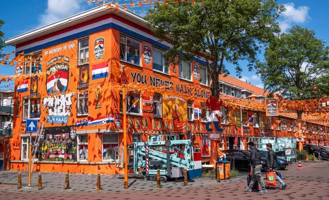 Marktweg Street in The Hague, Netherlands, is decorated ahead of the start of the soccer World Cup, Tuesday, June 9, 2026. (AP Photo/Patrick Post)