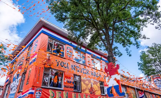 Marktweg Street in The Hague, Netherlands, is decorated ahead of the start of the soccer World Cup, Tuesday, June 9, 2026. (AP Photo/Patrick Post)