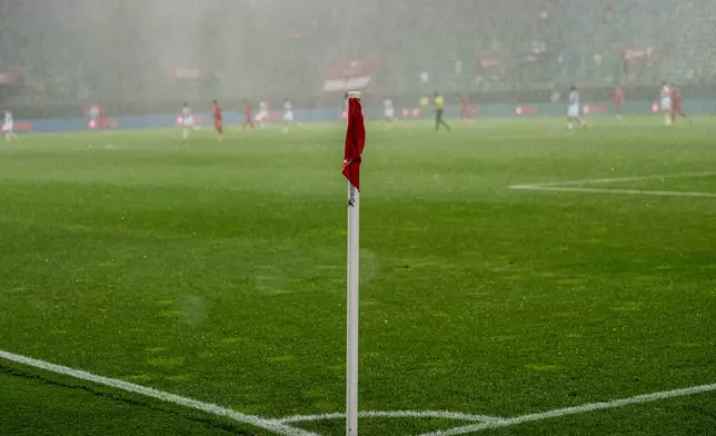 A pouring rain during the international friendly soccer match between Switzerland and Jordan in St. Gallen, Switzerland, Sunday, May 31, 2026. (Peter Schneider/Keystone via AP)