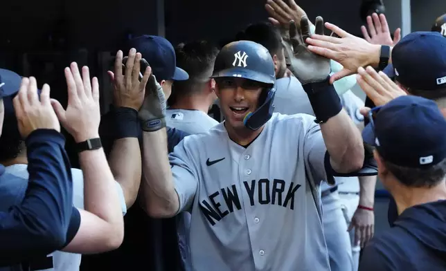 New York Yankees' Paul Goldschmidt celebrates with teammates after hitting a two-run home run against the Toronto Blue Jays during the ninth inning of a baseball game in Toronto, Saturday, June 13, 2026. (Frank Gunn/The Canadian Press via AP)