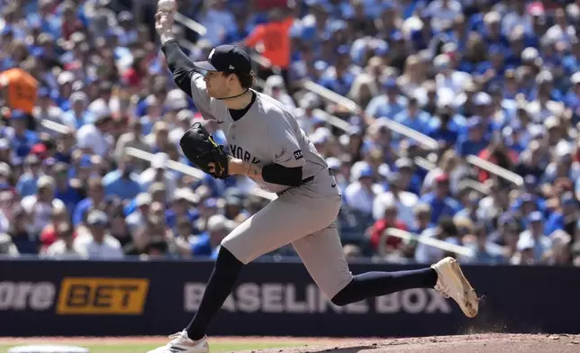 New York Yankees pitcher Cam Schlittler (31) works against the Toronto Blue Jays during the first inning of a baseball game in Toronto, Saturday, June 13, 2026. (Frank Gunn/The Canadian Press via AP)