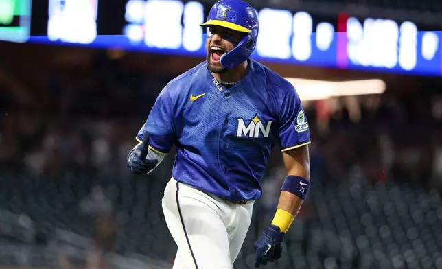 Minnesota Twins' Royce Lewis celebrates his solo home run against the St. Louis Cardinals during the eighth inning of a baseball game, Friday, June 12, 2026, in Minneapolis. (AP Photo/Matt Krohn)
