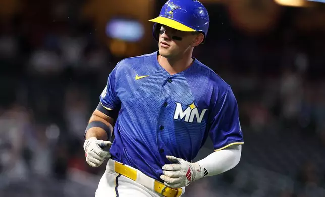 Minnesota Twins' Brooks Lee reacts runs the bases on his go-ahead solo home run against the St. Louis Cardinals during the eighth inning of a baseball game, Friday, June 12, 2026, in Minneapolis. (AP Photo/Matt Krohn)
