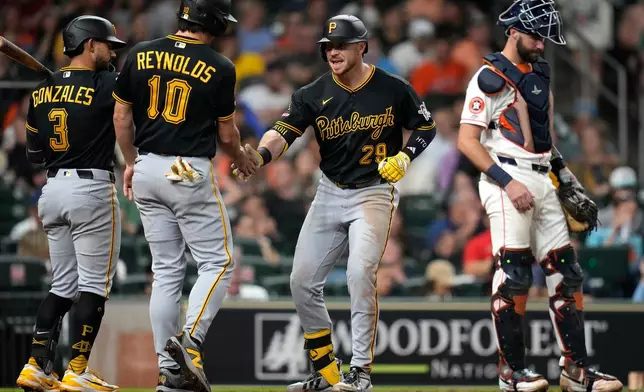 Pittsburgh Pirates' Ryan O'Hearn (29) celebrates his two-run home run with Bryan Reynolds (10) and Nick Gonzales (3) during the sixth inning of a baseball game against the Houston Astros, Thursday, June 4, 2026, in Houston. (AP Photo/Karen Warren)
