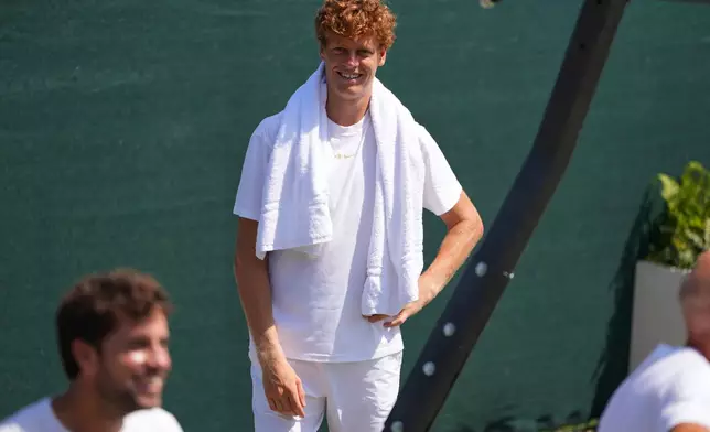 Jannik Sinner of Italy smiles during a training session at the All England Lawn Tennis and Croquet Club, ahead of the Wimbledon Championships in London, Thursday, June 25, 2026. (AP Photo/Kirsty Wigglesworth)