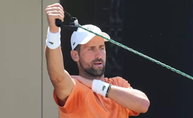 Novak Djokovic or Serbia attends a practice session ahead of the Wimbledon Tennis Championships, in London, Wednesday, June 24, 2026. (AP Photo/Kin Cheung)