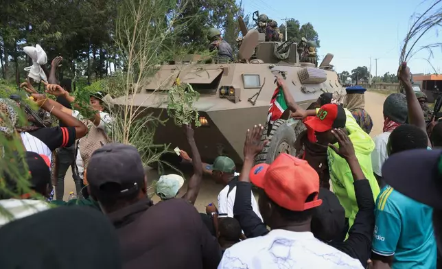 Kenyan soldiers on a tank patrol as protesters demonstrate against a proposed Ebola quarantine center to be established by the United States at Laikipia Air Base in Nanyuki, Kenya, Monday, June 1, 2026. (AP Photo/Andrew Kasuku)