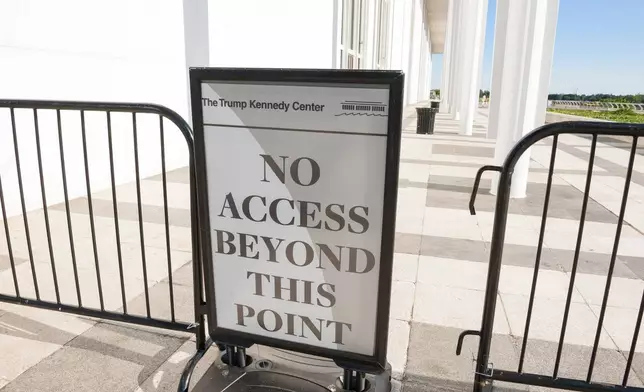 A sign on the patio overlooking the Potomac River at The John F. Kennedy Center for Performing Arts, in Washington, Friday, May 29, 2026. (AP Photo/Cliff Owen)