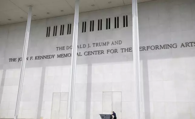 A man wheels a garbage bin outside of The John. F. Kennedy Center for the Performing Arts, Saturday, June 6, 2026, in Washington. (AP Photo/Rod Lamkey, Jr.)