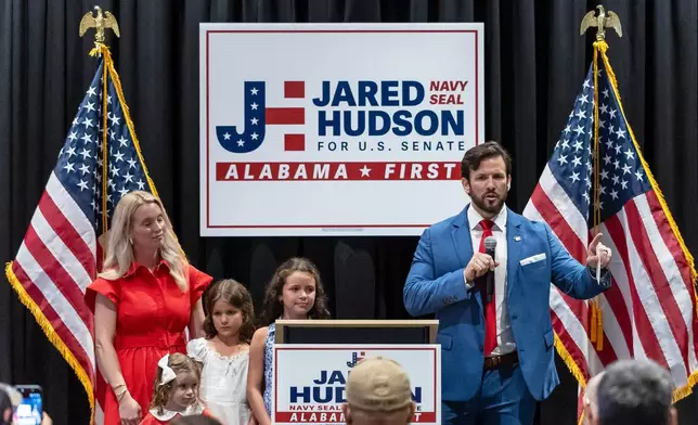 Republican candidate for U.S. Senate Jared Hudson, right, speaks at his runoff election night watch party alongside his wife, Lauren, and their children Tuesday, June 16, 2026, in Hoover, Ala. (AP Photo/Vasha Hunt)
