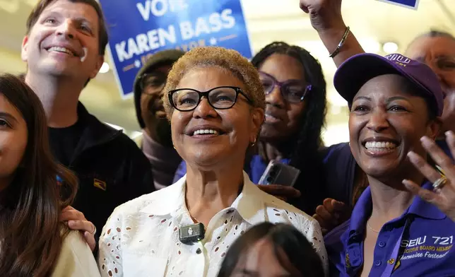 Los Angeles Mayor Karen Bass, center, poses for a group photo during a campaign event at SEIU 721 headquarters in Los Angeles on Saturday, May 30, 2026. (AP Photo/Scott Strazzante)