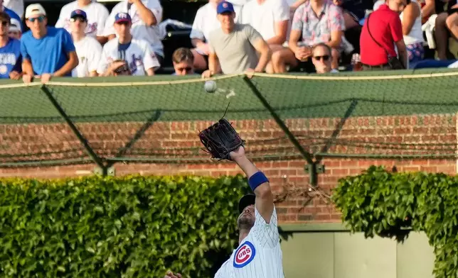 Chicago Cubs right fielder Michael Conforto catches a fly ball hit by Athletics' Nick Kurtz during the first inning of a baseball game in Chicago, Thursday, June 4, 2026. (AP Photo/Nam Y. Huh)