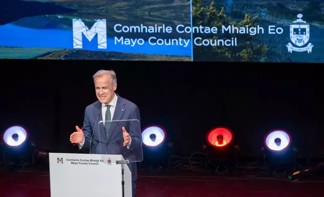 Canadian Prime Minister Mark Carney delivers a speech during his visit to Westport Town Hall Theatre in Westport, Ireland, Sunday, June 14, 2026. (Andrew Downes/PA via AP)