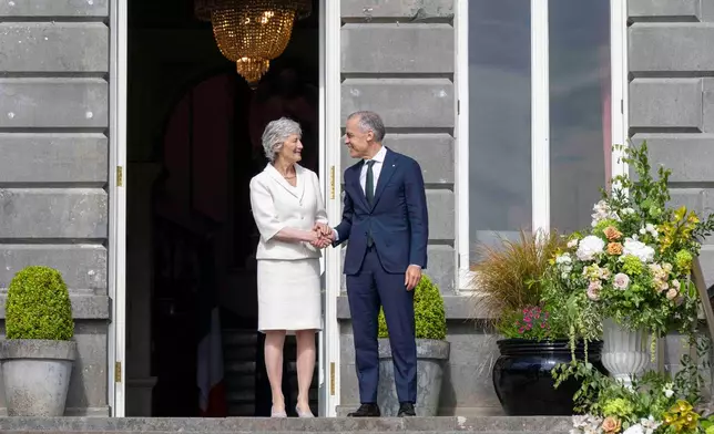 President of Ireland Catherine Connolly, left, and Canadian Prime Minister Mark Carney, right, during a visit to Westport House in Westport, Ireland, Sunday, June 14, 2026. (Andrew Downes/PA via AP)