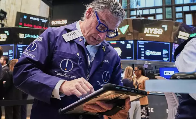 Trader John Romolo works on the floor of the New York Stock Exchange, Wednesday, June 3, 2026. (AP Photo/Richard Drew)